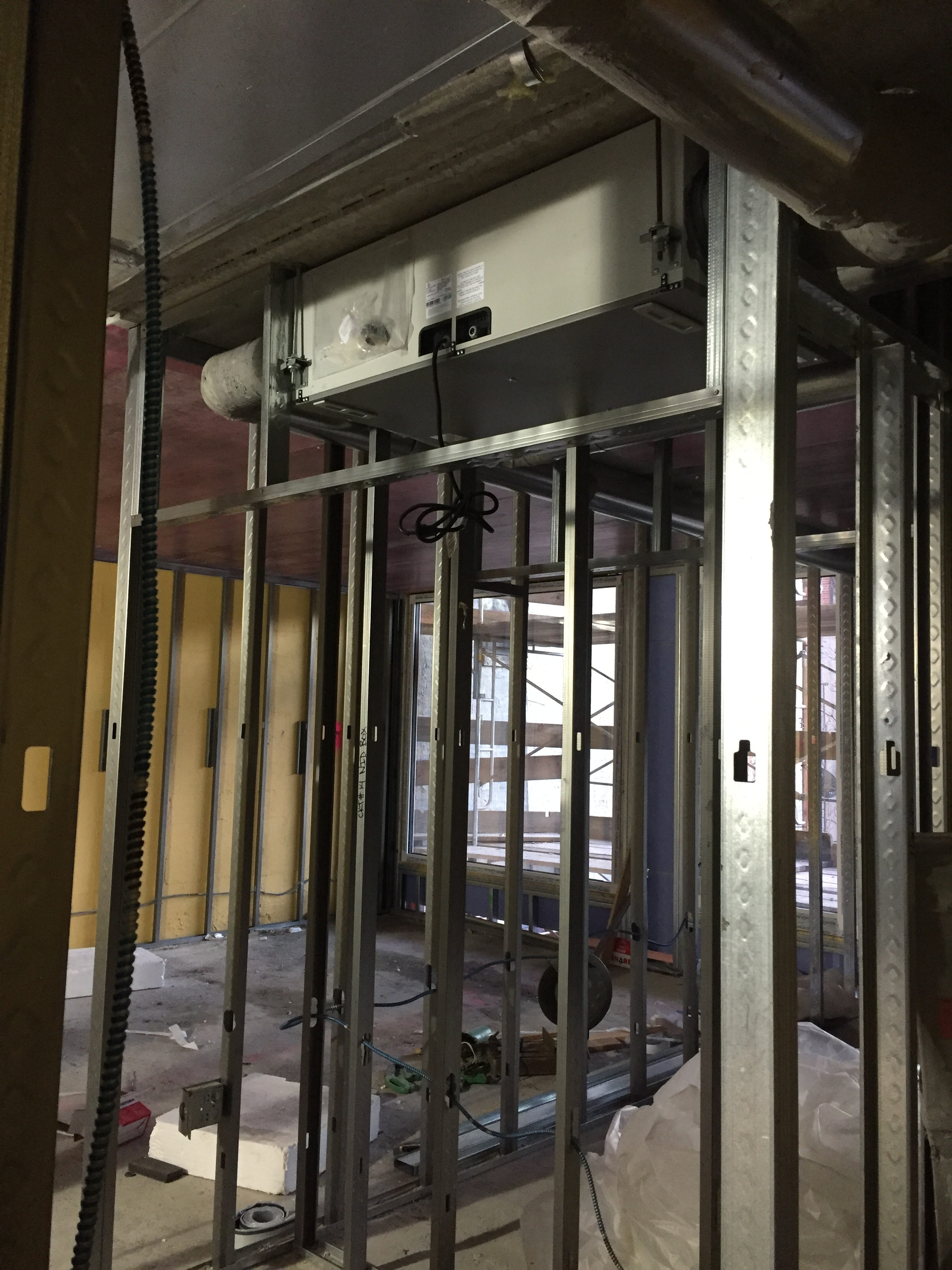 An ERV unit being installed at 542 West 153rd Street