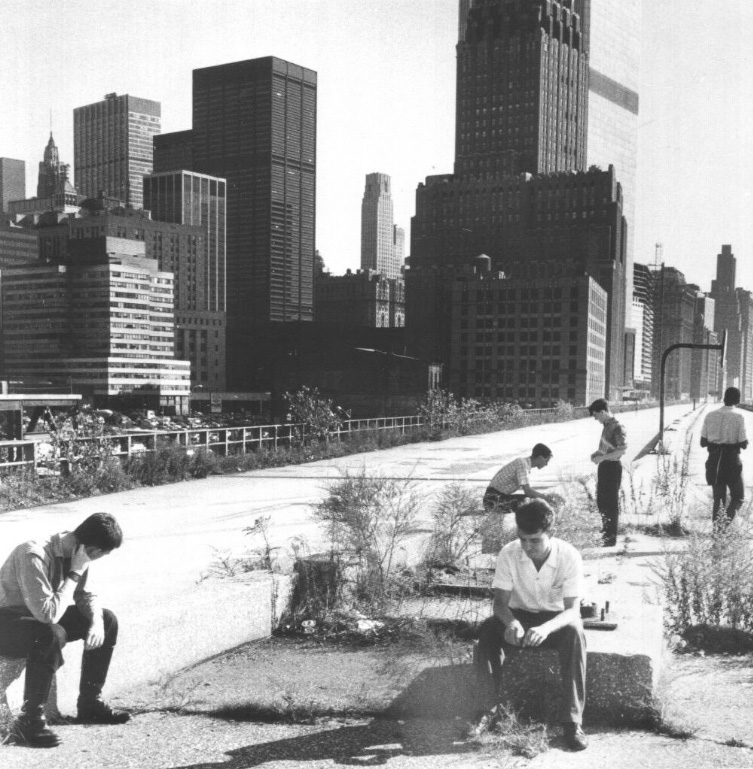 Members of the post-punk band A Certain Ratio atop the abandoned expressway. Circa 1980-1981. In a couple of years, the viaduct would be gone and 101 Murray would stand at the center of the photo. Unknown photographer