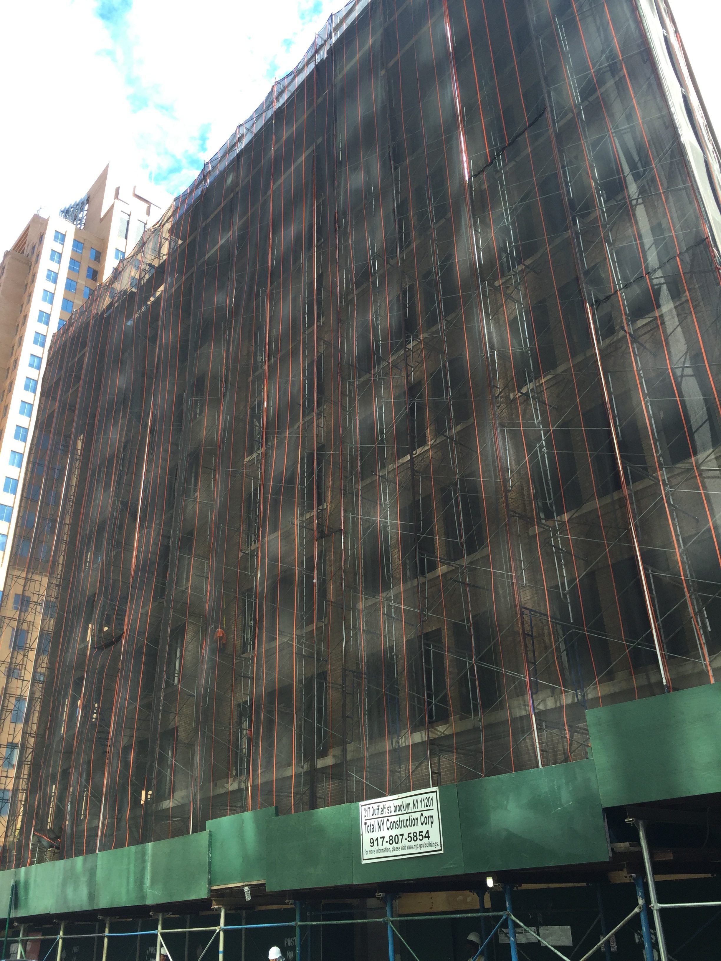 217 Duffield Street shrouded in scaffolding, photo by Tectonic