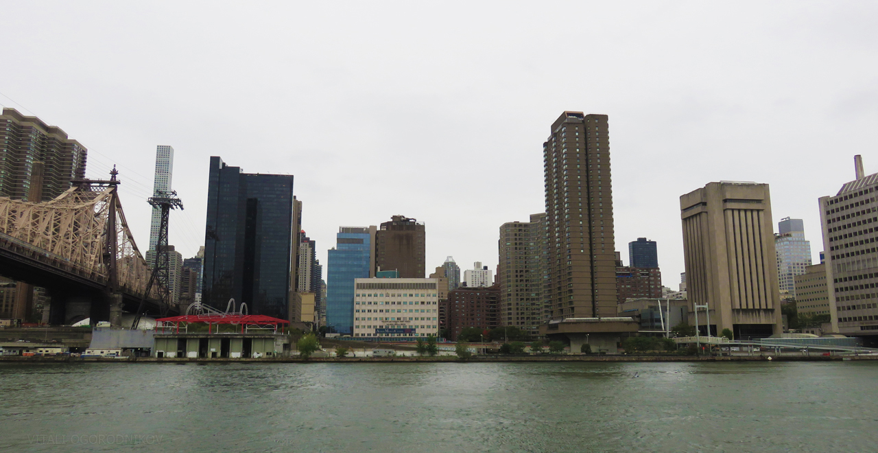Queensboro Bridge is on the left. The Scholars Building is in the center right. Looking west.