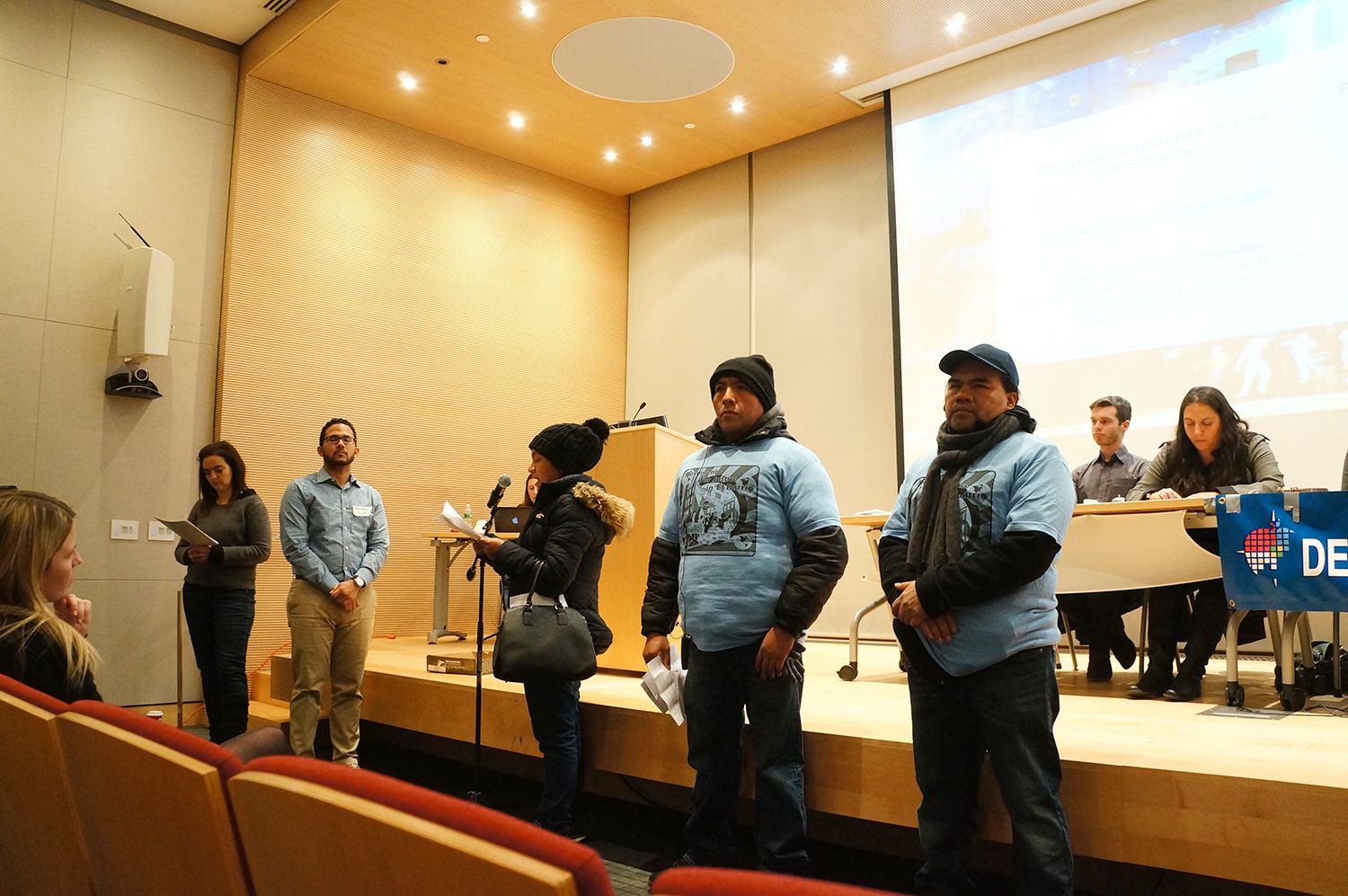 Activists from the Movement for Justice in El Barrio speak at last Thursday's public meeting on the East Harlem rezoning. photo by Rebecca Baird-Remba
