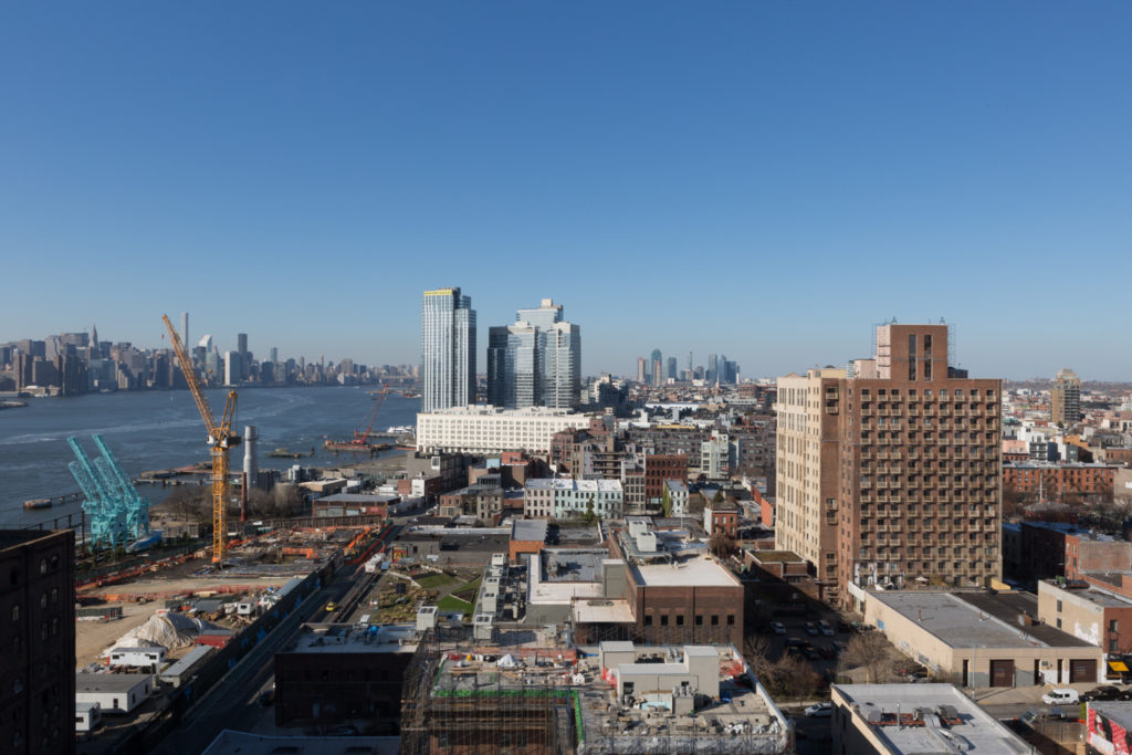 Looking north towards Midtown from 325 Kent Avenue rooftop, 260 Kent Avenue's construction site is to the left, image by Andrew Campbell Nelson