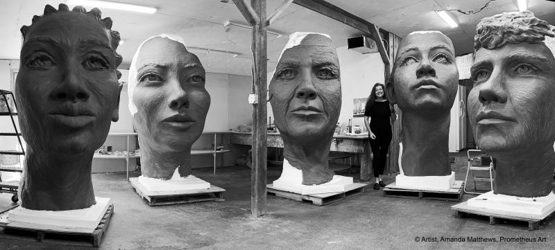 Artist Amanda Matthews with full size clay faces of The Girl Puzzle - © Amanda Matthews, Prometheus Art