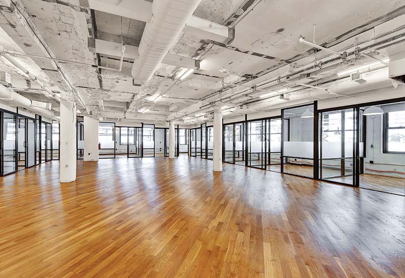 Open floor plan with glass wall offices at 349 Fifth Avenue - Zar Property NY