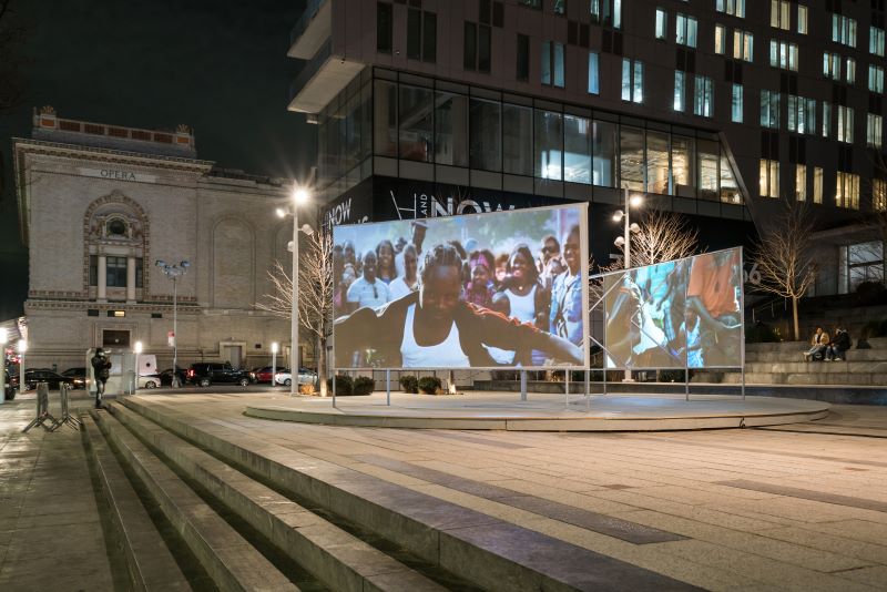 Outdoor screen projections at the 300 Ashland Place plaza - Cameron Blaylock for Downtown Brooklyn Partnership