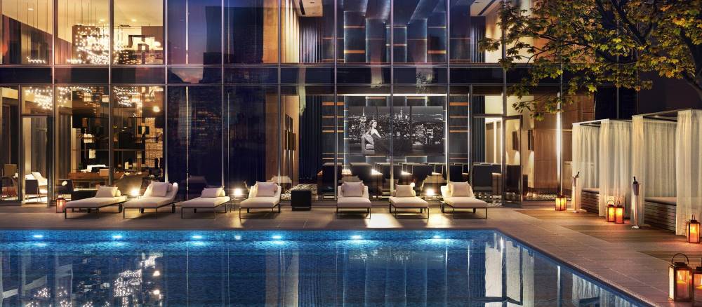 Evening rendering of the outdoor pool and sun deck at Central Park Tower - Courtesy of Extell