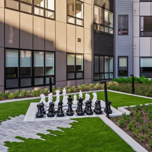 Life-size chess board in the outdoor courtyard at Ivy and Green (1 Park Avenue)