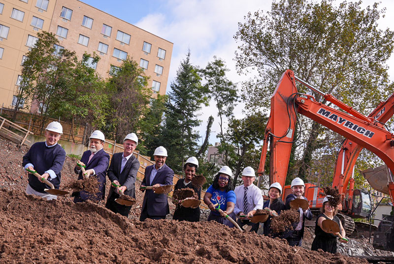 Project partners celebrate the beginning of construction at the Fischer Senior Apartments