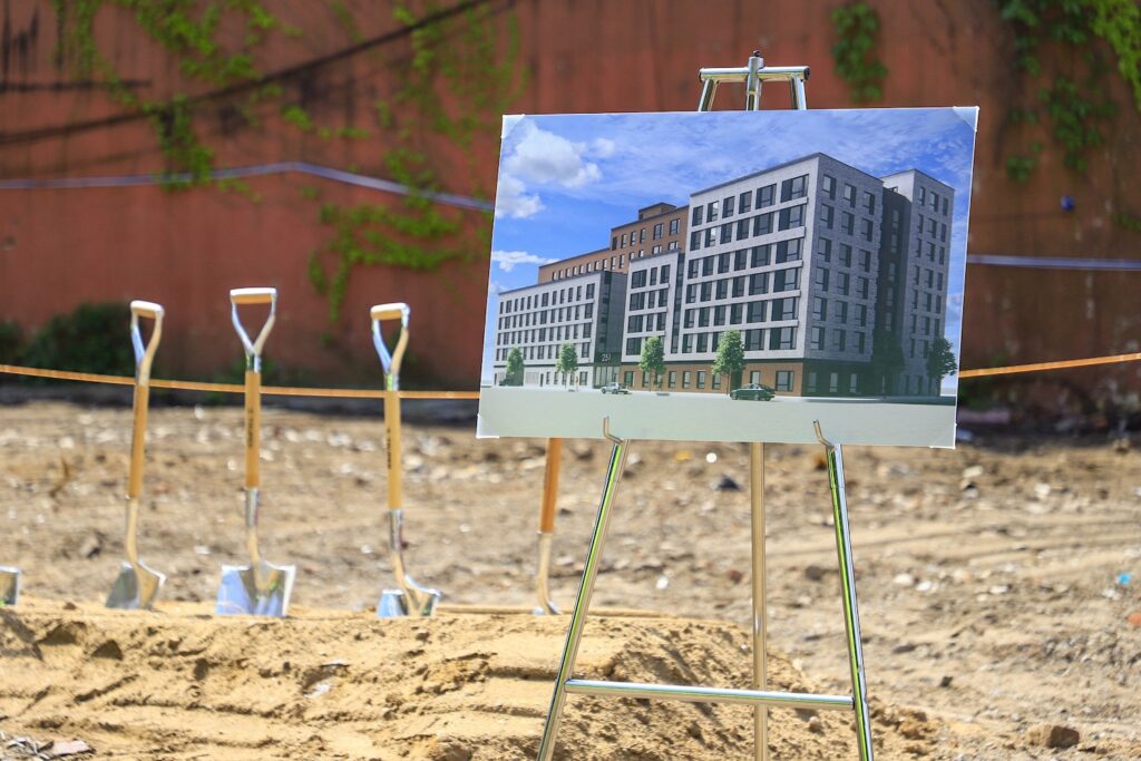 Photograph of building rendering from groundbreaking ceremony, courtesy of Services for the UnderServed, the Osborne Association, and L+M Development Partners