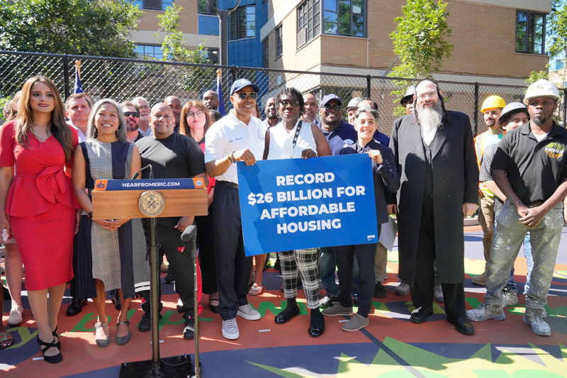 Photograph from affordable housing budget announcement, via nyc.gov