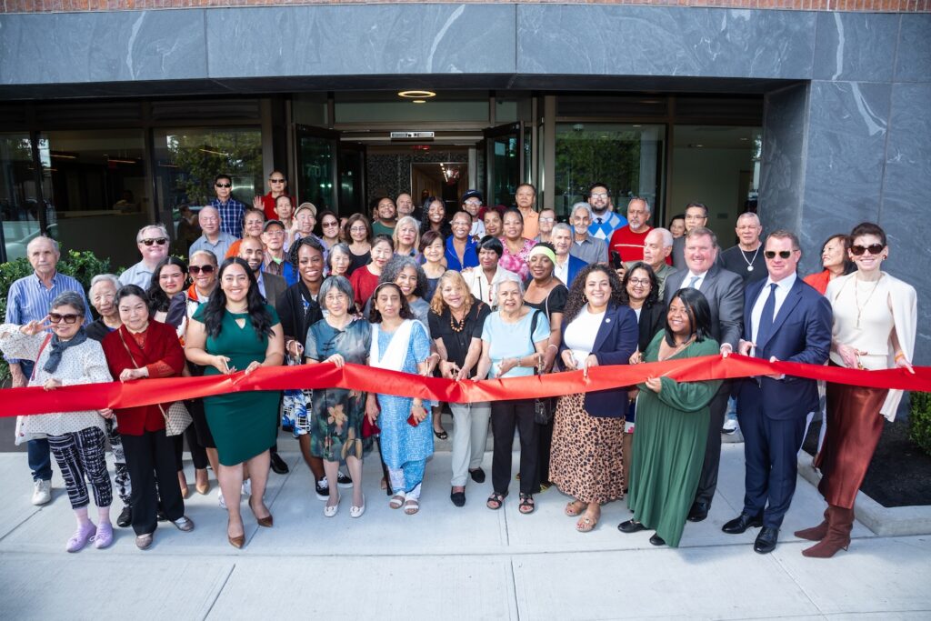 Photograph of ribbon cutting ceremony at Parkchester Gardens. Credit: Olshan Properties