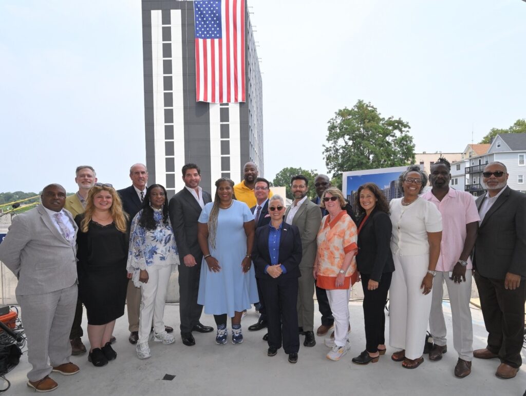 From left, Mount Vernon Corporation Counsel Brian Johnson; Mount Vernon Commissioner of Planning & Community Development James Rausse; Mount Vernon First Deputy Buildings Department Commissioner Hediye Mamak; Simone Development Director of Strategic Initiatives Kevin Plunkett; Rev. Dr. L’ Judie Matt-Simmons; Simone Development President Joe Simone; Mount Vernon Mayor Shawyn Patterson-Howard; Council President Derrick Thompson; Stagg Group President Mark Stagg; Executive Director Mid-Hudson Regional Economic Development Council Linda Malave; Downstate Development Director Russ Karp; Westchester County Executive Ken Jenkins; Deputy County Executive Joan McDonald; Westchester County Planning Commissioner Bianca Lopez; Councilwoman Cynthia Turnquist; Mount Vernon Building Department Commissioner Patrick Holder; and Mount Vernon Comptroller Dr. Darren Morton